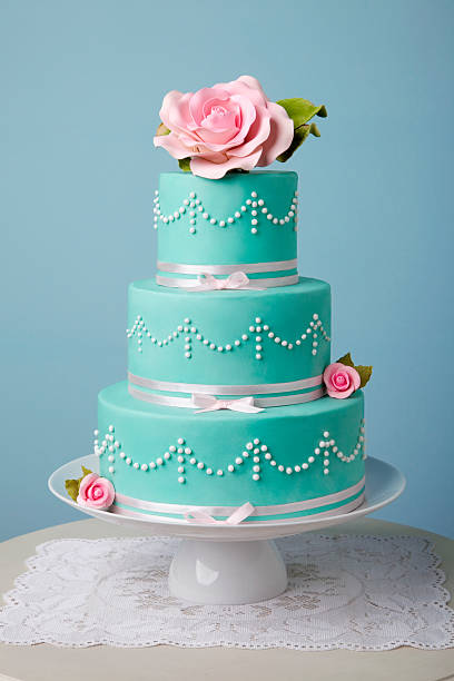 beautiful turquoise cake three tire turquoise cake decorated with flower wedding cake stock pictures, royalty-free photos & images