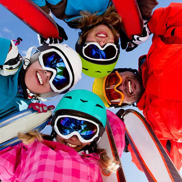 Ski family, snow, sun and winter fun stock photo
