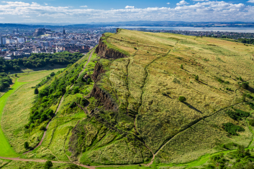 Sunny Edinburgh and green hills in summer.