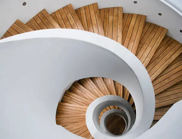 Photo of Modern spiral staircase with wooden planks