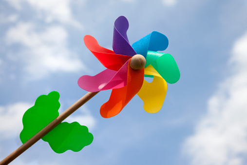 Colored windmill toy with sky background