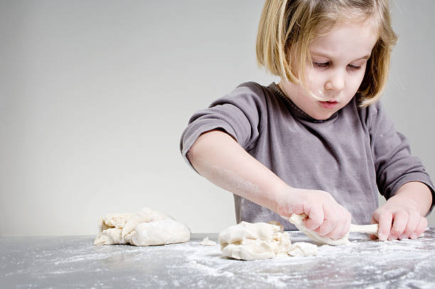 istock A you girl, about 6, is baking  154966678