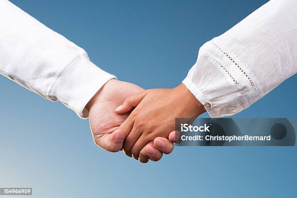 Couple Holding Hands Stock Photo - Download Image Now - 20-24 Years, A Helping Hand, Adults Only