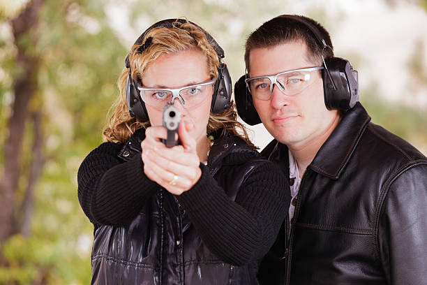 istock Man and Woman at the Shooting Range 154967395