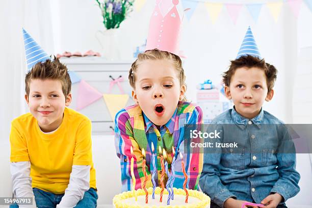 Blowing Out Candles At Birthday Party Stock Photo - Download Image Now - Birthday, Child, Studio Shot
