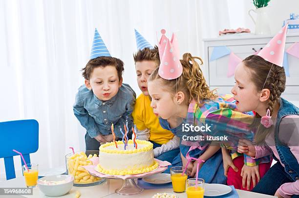 Blowing Out Birthday Candles Stock Photo - Download Image Now - 6-7 Years, 8-9 Years, Birthday