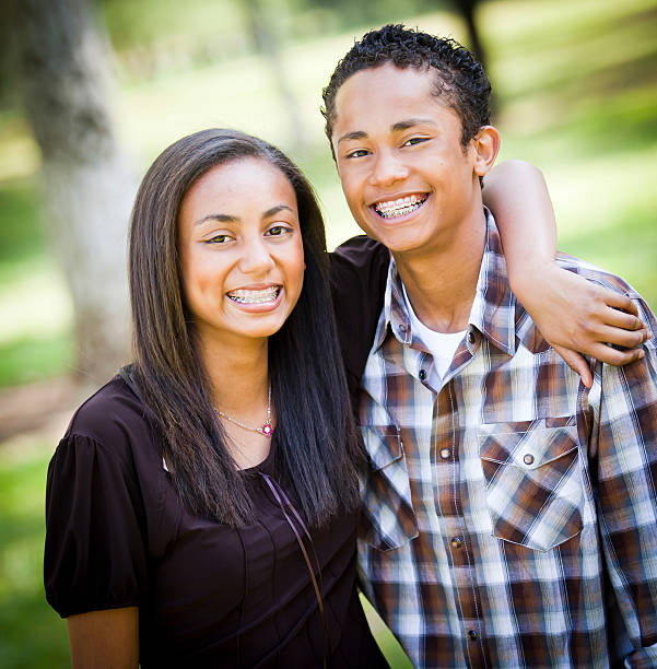 Love, family and people concept: lovely happy couple hugging over white background.