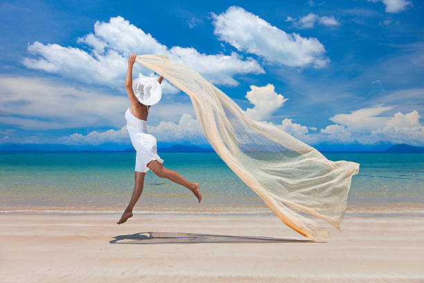 Happy woman on the beach stock photo