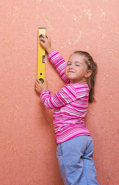 istock Little girl with measurement level 154973169
