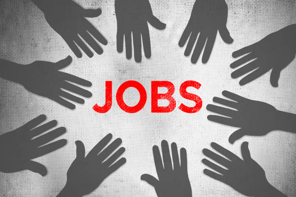 Silhouette of hands with letters JOBS - job search and application