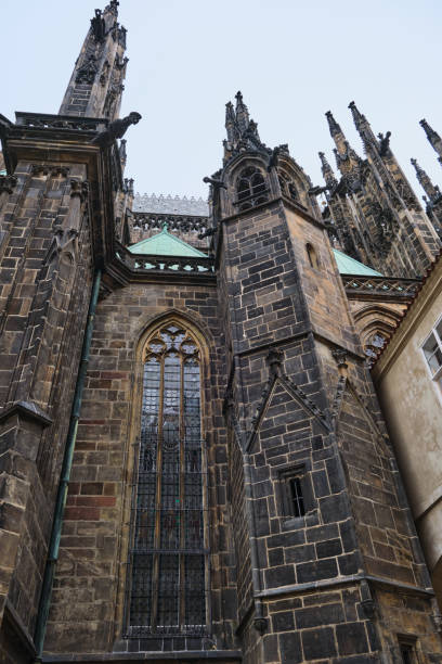 Lateral view of St. Vitus cathedral Castle in Prague, Czech Republic clock tower, low angle stock photo