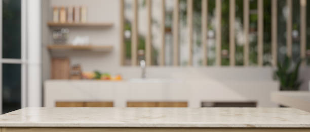 istock Empty space on a tabletop with a blurred background of a modern kitchen. 1549746160