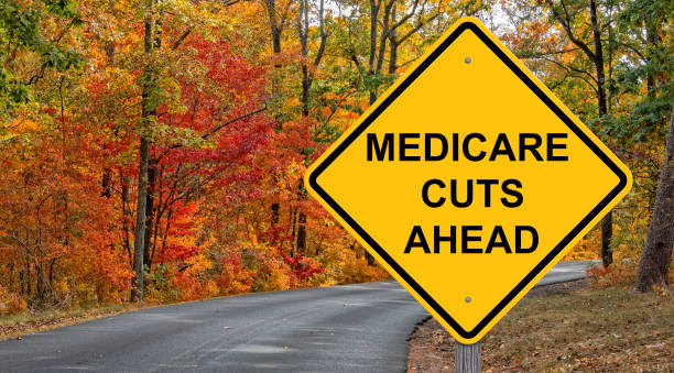 istock Medicare Cuts Ahead Caution Sign - Autumn Background 1549796074