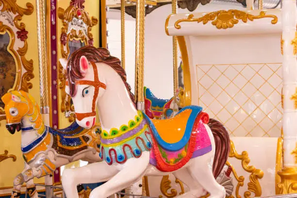 Photo of Graceful Elegance: Exquisite Detail of a White Carousel Horse