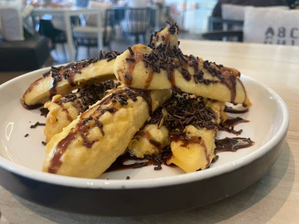 istock Chocolate fried bananas on a plate 1549828062