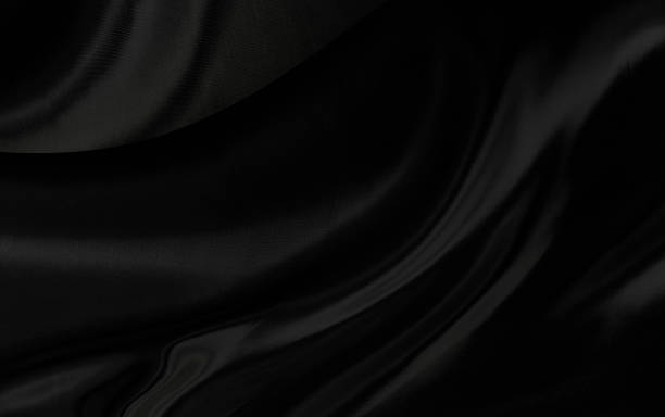 istock Black gray satin dark fabric texture luxurious shiny that is abstract silk cloth background with patterns soft waves blur beautiful. 1549840994