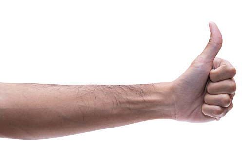 Caucasian male hand doing a thumb up gesture on white background