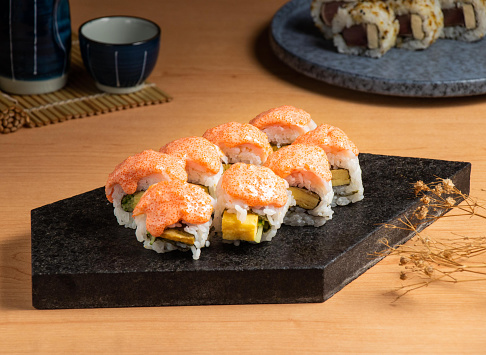 Shrimp Roll with Mentaiko served isolated on wooden board top view of japanese food