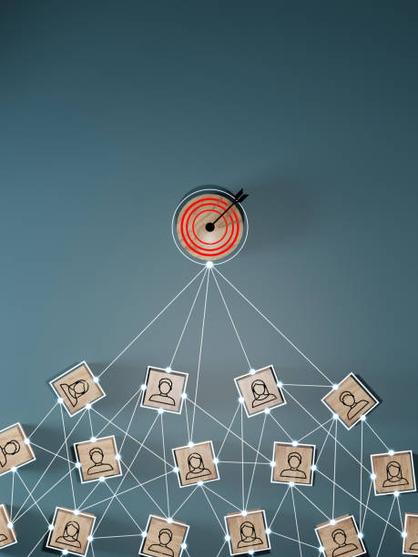 istock Red dartboard and black arrow connection linkage with human icon for customer focus target group and customer relation management concept. 1549852812