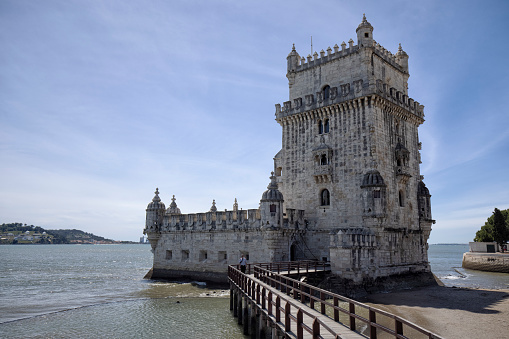 Lisbon, Portugal - Torre de Belem on the bank of the Tagus River on a sunny summer afternoon.