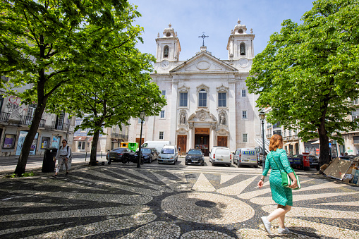 Lisbon, Portugal - Street view of Church of São Paulo in Praça de São Paul on a summer afternoon. People and cars can be seen.
