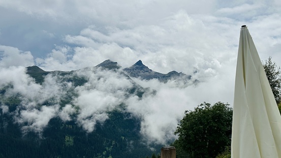 Vals mountains, Graubunden canton, Switzerland, fog over the mountain peaks