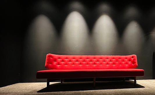 Red sofa, illuminated halos in the background