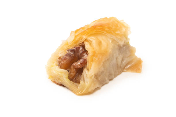 istock Delicious sweet baklava with walnuts isolated on white background. 1549965180