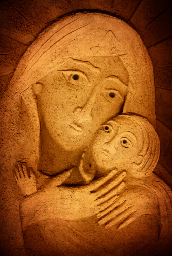 Saint Mary with the Child Jesus:ceramic relief by my wife, Gabi Kiss. Converted to sepia toned aged image.