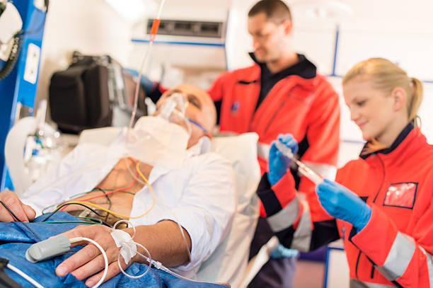 istock Sick patient being treated by paramedics in an ambulance 154997160