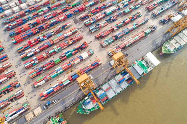 Container ship in import export tradeport top view from drone, Business logistic