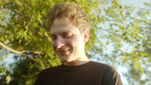 istock Handsome Blond Young Man Checking a Message or Notification on his Smartphone 1549980451
