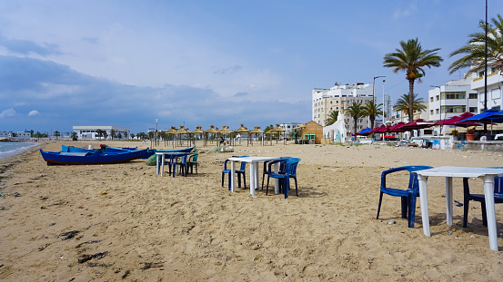 Bibione, Italy - August 16, 2021:Beach view with all open umbrellas to shelter from the summer heat overlooking the Adriatic Sea in Bibione spiaggia