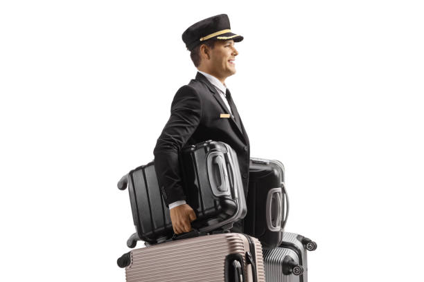 istock Bellboy carrying many suitcases 1550026147