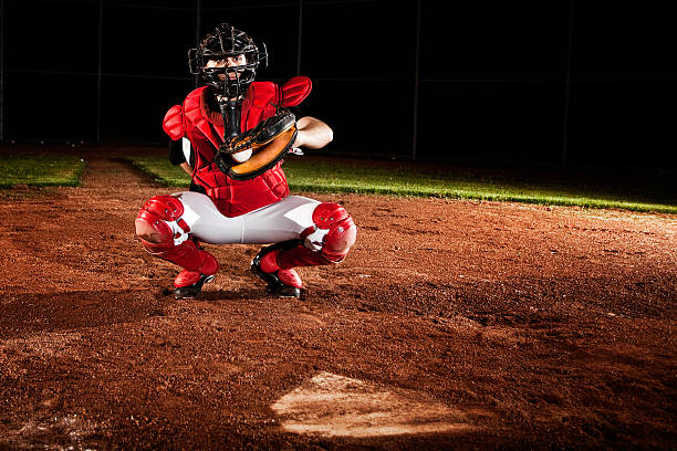 baseball-spieler (catcher) at home plate - baseball player flash stock-fotos und bilder