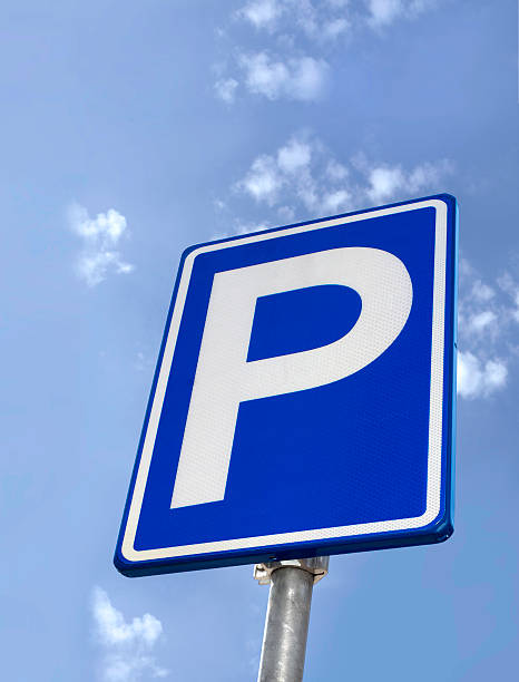 istock Looking up at a blue parking sign with white border 155004320