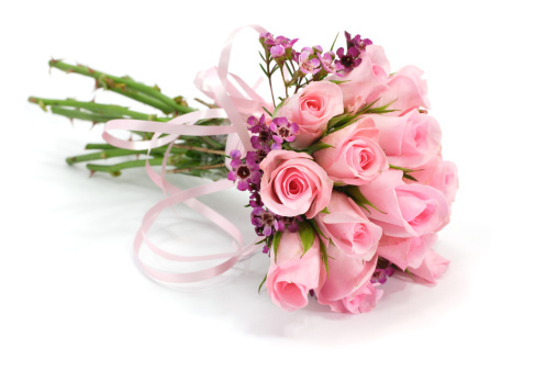 Beautiful bouquet of fresh roses, carnation, freesias, hydrangea, eucalyptus in tender pink and white colors, bouquet of flowers close up.