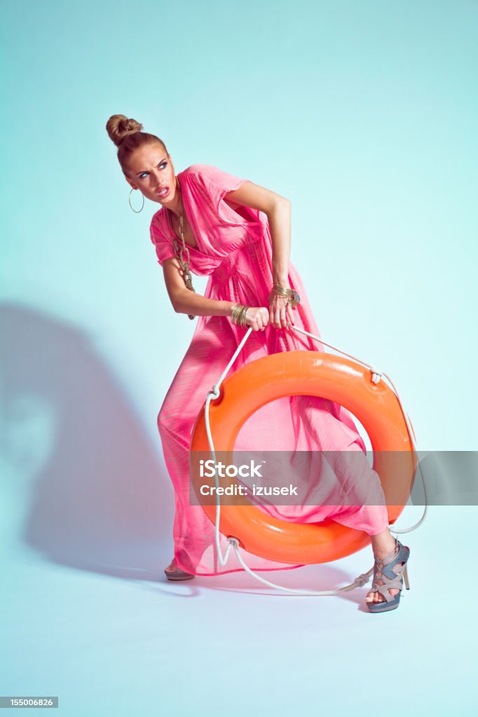 Glamour portrait of woman posing with a lifebuoy  Fashion Stock Photo