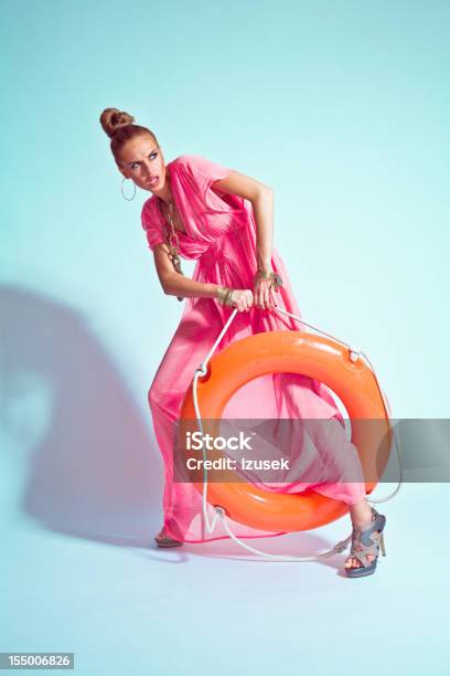 Glamour Portrait Of Woman Posing With A Lifebuoy Stock Photo - Download Image Now - Fashion, Summer, Fashion Model