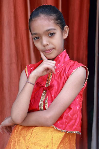 istock An Indian little pretty girl in different poses. 1550070073