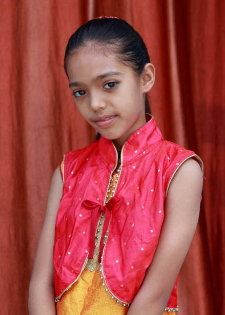 istock An Indian little pretty girl in different poses. 1550070674