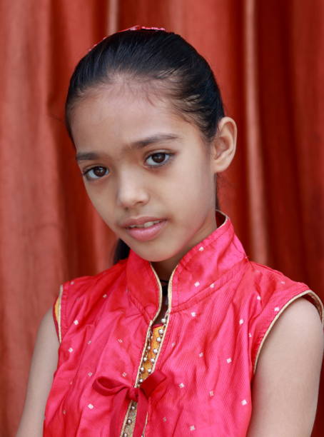 istock An Indian little pretty girl in different poses. 1550070691