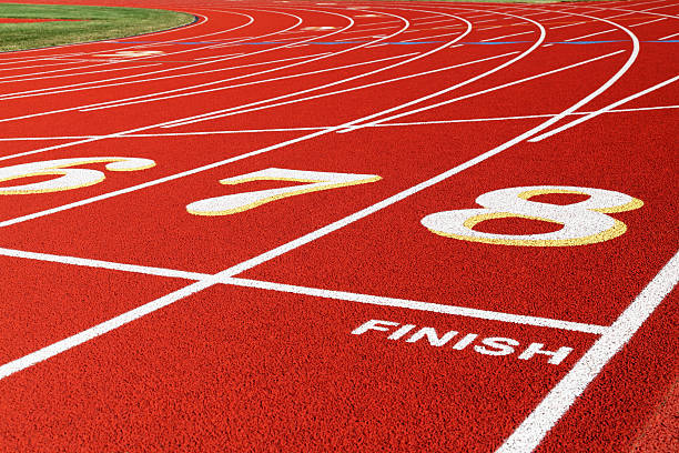 istock Finish Line Lanes on Red Running Race Track Closeup 155007092