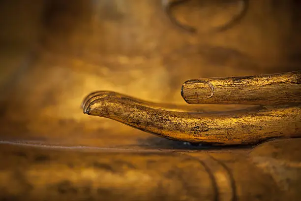 Photo of golden thai buddha hand detail