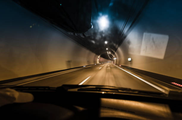 Driving a car in the tunnel. View on highway tunnel with motion blur from the car seat through the windglass