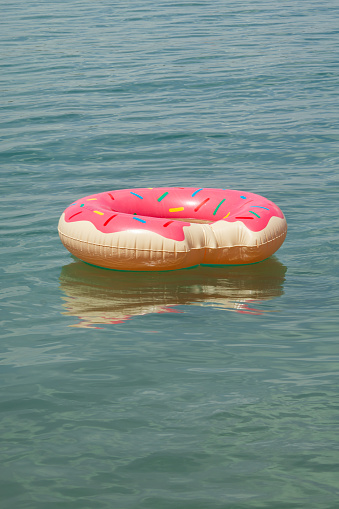 A fun inflatable ring for the safe swimming of children in the sea.