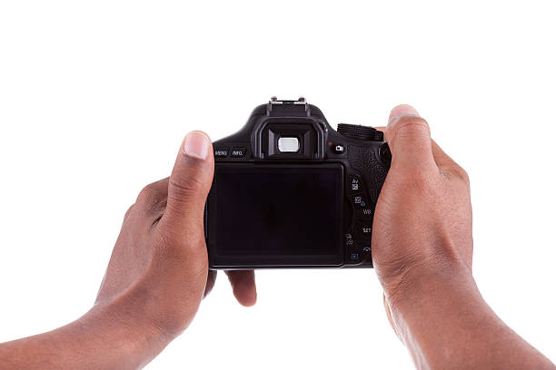 istock African american photographer holding a digital camera 155010390