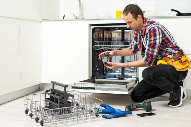 istock Technician examining dishwasher. High quality photo 1550120451