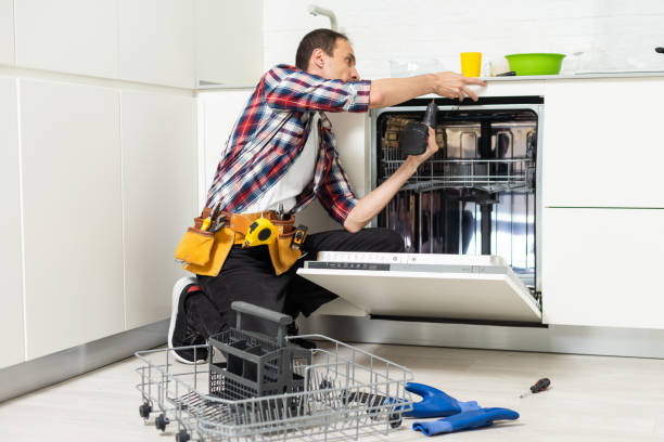 istock Technician examining dishwasher. High quality photo 1550123017