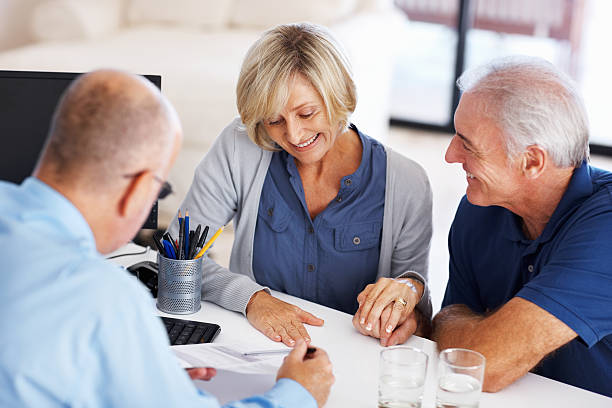 istock Senior couple reading investment plans 155012310